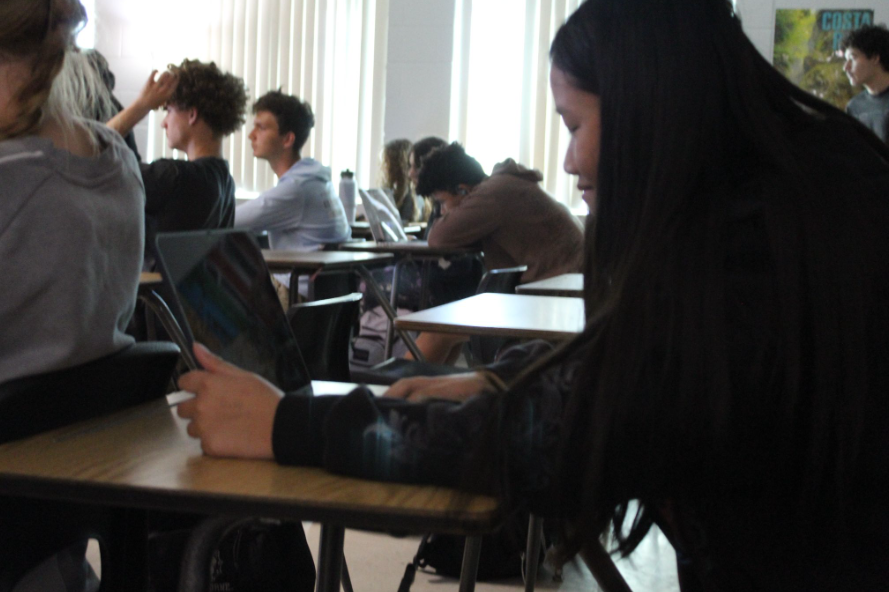 Steady, Ready and Focused: 11th grader,  Sophie Yang worked on a paper during class. She focuses on completing her assignment while organizing and writing her  ideas on the page. “I work better planning!” Yang says. The work helps her prepare for any upcoming tests and jsut overall being ready,  and improving her writing skills.  Copy: Paige Allen  Photo; Paige Allen
