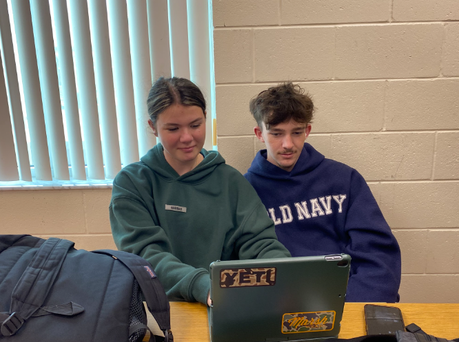 Critical sleep. These students Bailey Ballard and Kegan MacDonald at Melbourne high school are doing their homework at school, due to both of them having jobs and being seniors. Student Bailey Ballard said “ They put too much pressure with no help” PHOTO BY: Madison Davis
