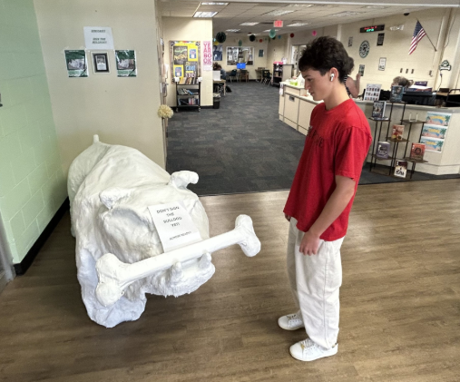 Anticipation is in the Air: Seniors like Sammy Orellana eagerly wait to sign the Bulldog statue. On September 18, the Media Center will host a Bulldog Signing Party where seniors can officially mark their place in school history on the Bulldog. “I cannot wait to sign the Bulldog. I can’t wait for people to see my name on the Bulldog for a whole year,” says Orellana. Photo by Kyle McLaren