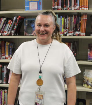 Another Chapter: Mrs. Carrie Friday celebrates her birthday with students and staff at Melbourne High School. She’s been part of the school for three years and has worked hard to make the library feel welcoming, adding sofas, painting the walls, and filling it with more books. She shared a fun fact that she can actually write with her toes, and reminded students to check out Sora, the online library with way more books than the shelves hold. Thinking about her special day, Mrs. Friday said, “It is better to spend my birthday here at school than to spend it at Disney World.” Photo by Lily Majors