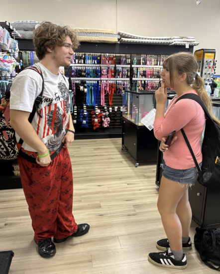 Brain Power Over Break: Two ninth grade students at Melbourne High, William King and Faith Helmes, are sharing their plans for studying and preparing for their upcoming state tests after spring break at their school, explaining what subjects they are focusing on and why reviewing their work during the break helps them stay prepared and motivated for their exams after school at a pet store. Both students mention that they plan to set aside specific times each day to study so that they can stay organized and not fall behind.  King says “practicing problems helps me understand the concepts better,” while Helmes says “reviewing my notes and doing practice essays help me feel more confident.” They both agree that studying over break will give them a head start for when they return to school.  Photo by Ava Brouard