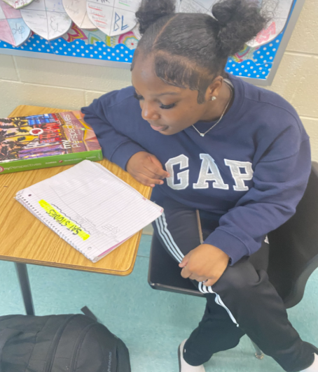 Caption: SAT STUDIES:During class students gain insight from teachers on ways to prepare for SAT testing. 11th grade student Jayla Hopkins has been studying for her upcoming SAT. Taking up these studies ahead of time hasl helped her grow confident in her testing skills. Hopkins said, “Preparing early with my studies for the SAT, has been very helpful.” There are numerous ways to ready yourself for the test. Hopkins said, “Practicing through taking the online sat practice test has been very useful.” Photo by Princess Islam