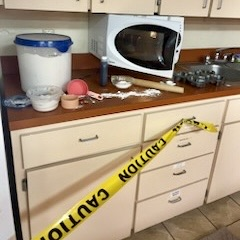crime scene 10, microwave dishes, and spilled food.