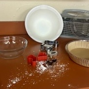 spilled food, dishes, and various messy food preparation items