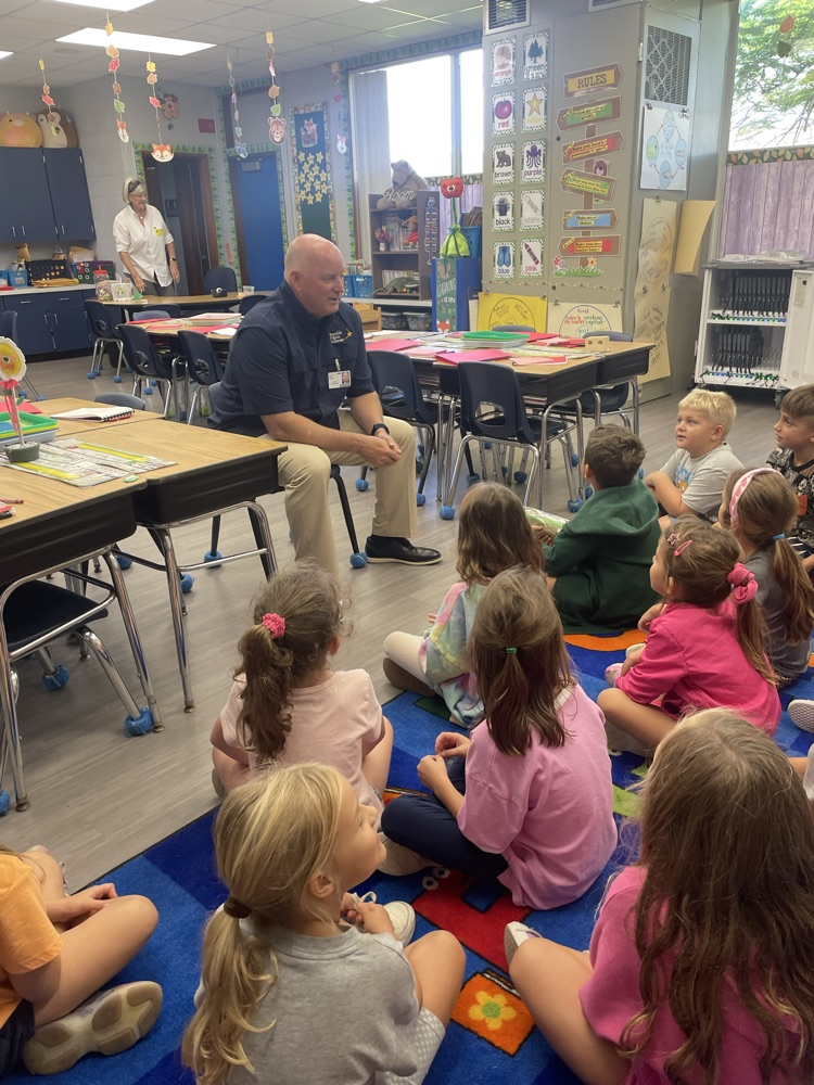 Dr. Rendell answers student questions while visiting classrooms