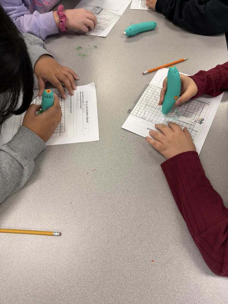students using 3 Doodler pens to create bubble wands