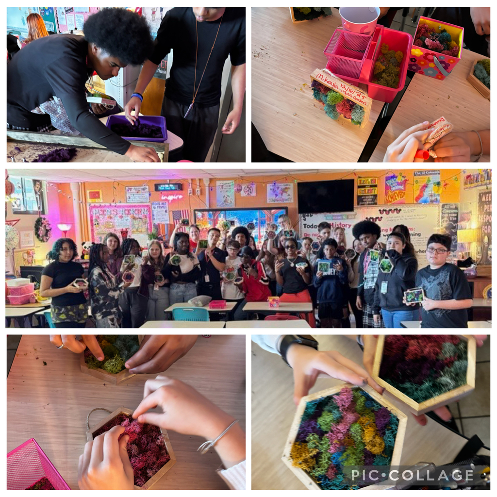 students in a classroom working on a moss garden