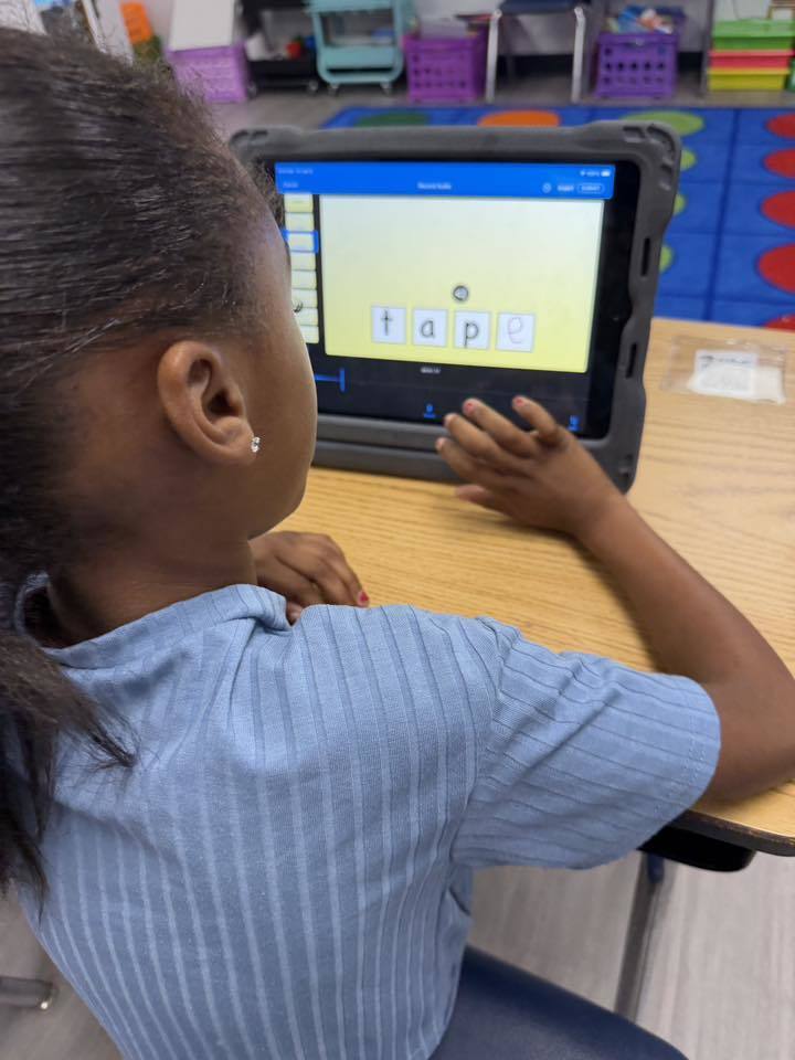 Students using iPads to practice 'Long A' and 'Magic E' 