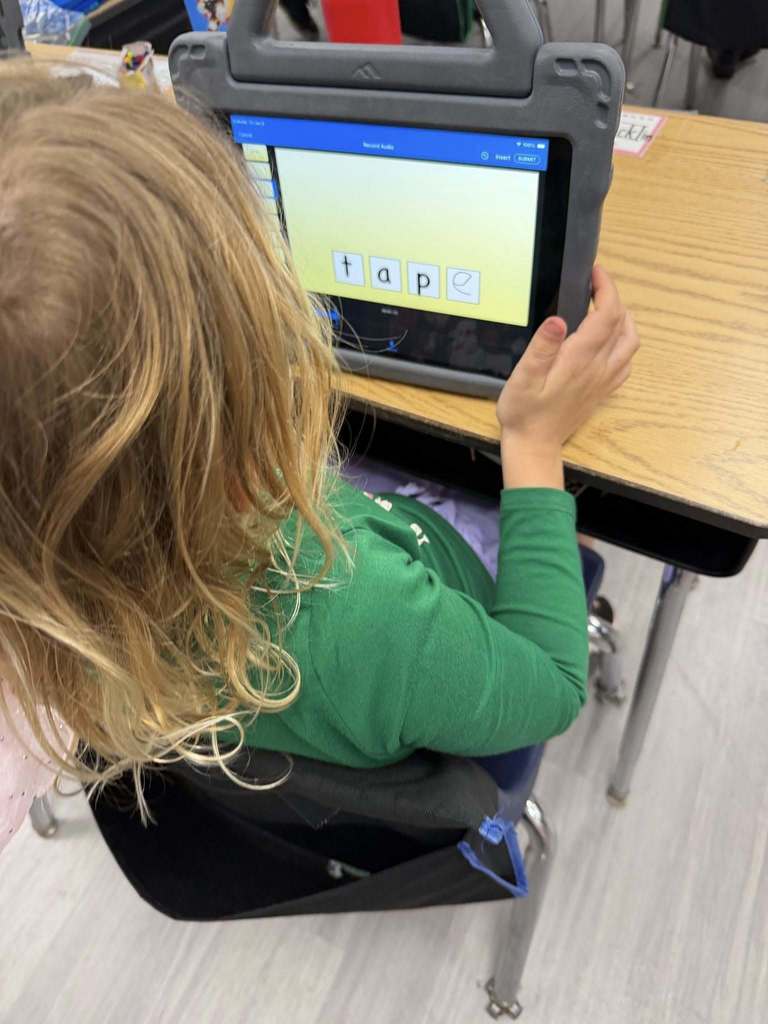 Students using iPads to practice 'Long A' and 'Magic E' 