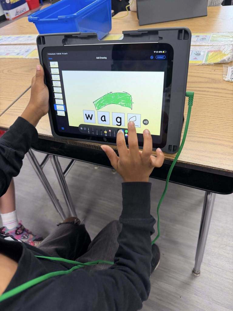 Students using iPads to practice 'Long A' and 'Magic E' 