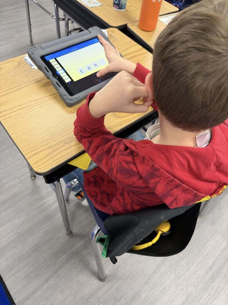 Students using iPads to practice 'Long A' and 'Magic E' 