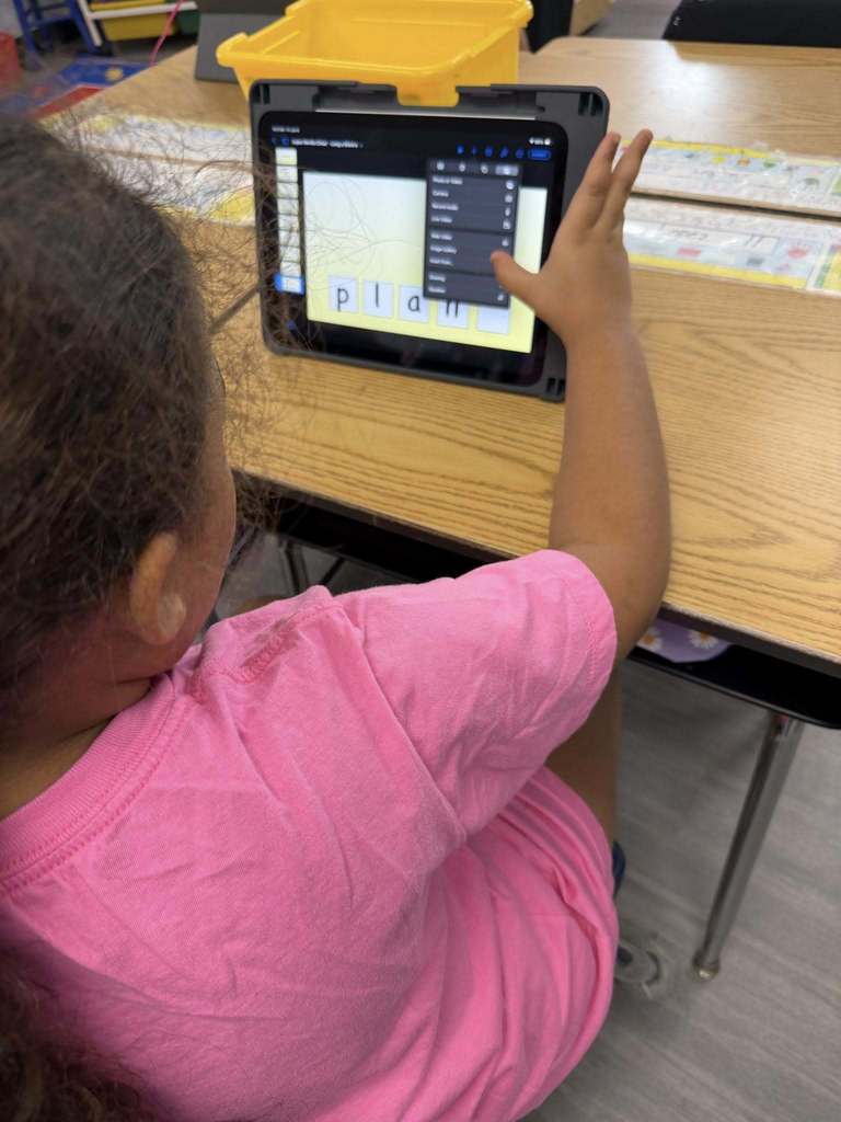 Students using iPads to practice 'Long A' and 'Magic E' 