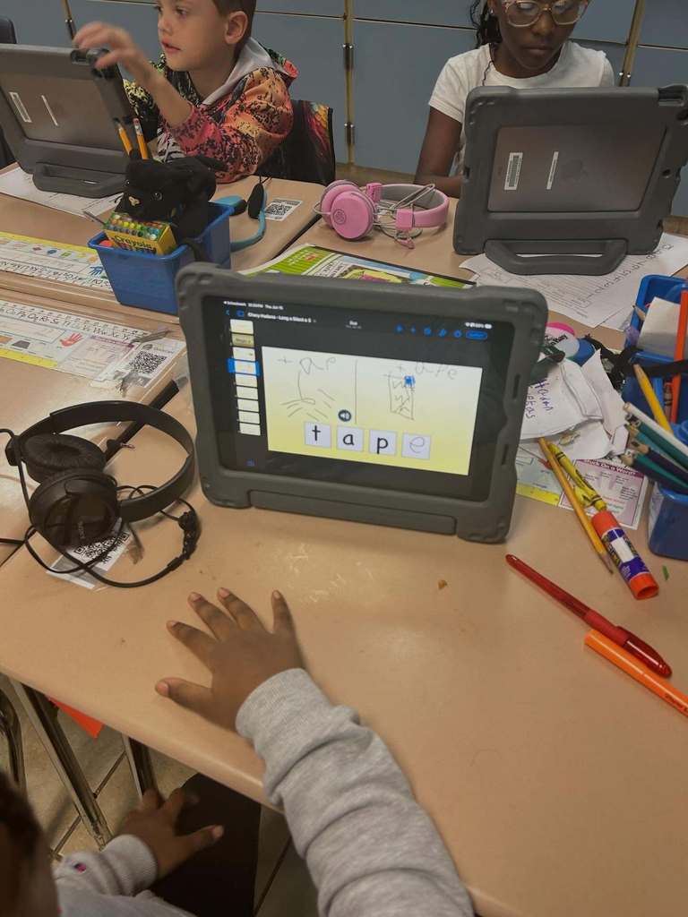 Students using Keynote on the iPad to practice "magic E" and "Short A"