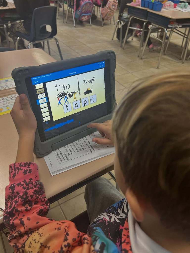 Students using Keynote on the iPad to practice "magic E" and "Short A"