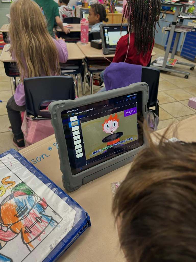 Students using Keynote on the iPad to practice "magic E" and "Short A"