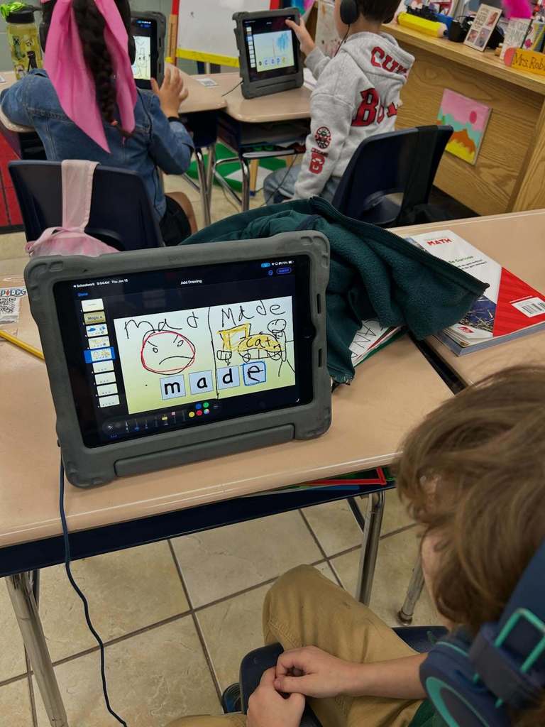 Students using Keynote on the iPad to practice "magic E" and "Short A"