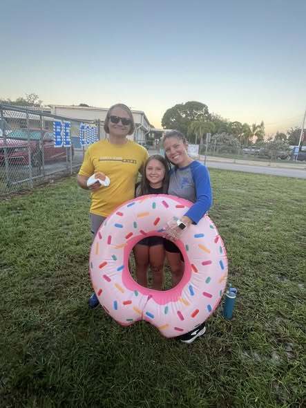 parents with donut inflatable