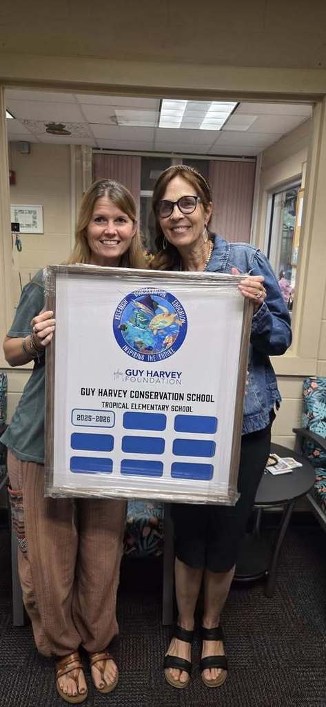 Rice and Ehley holding plaque