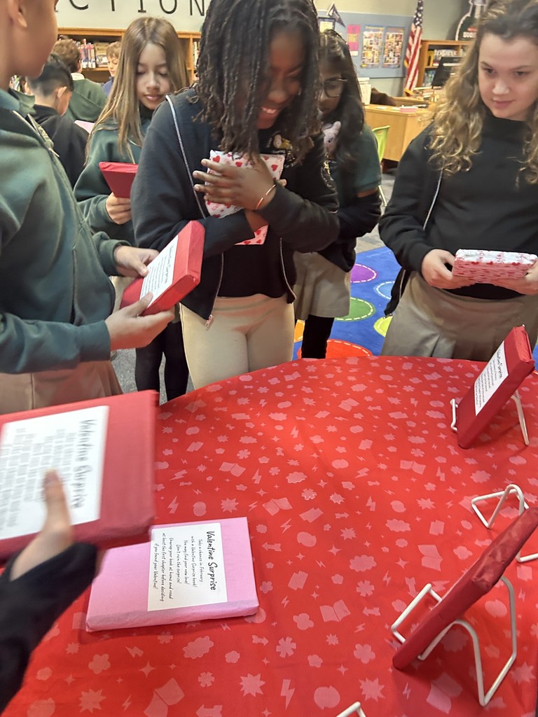 students checking out books