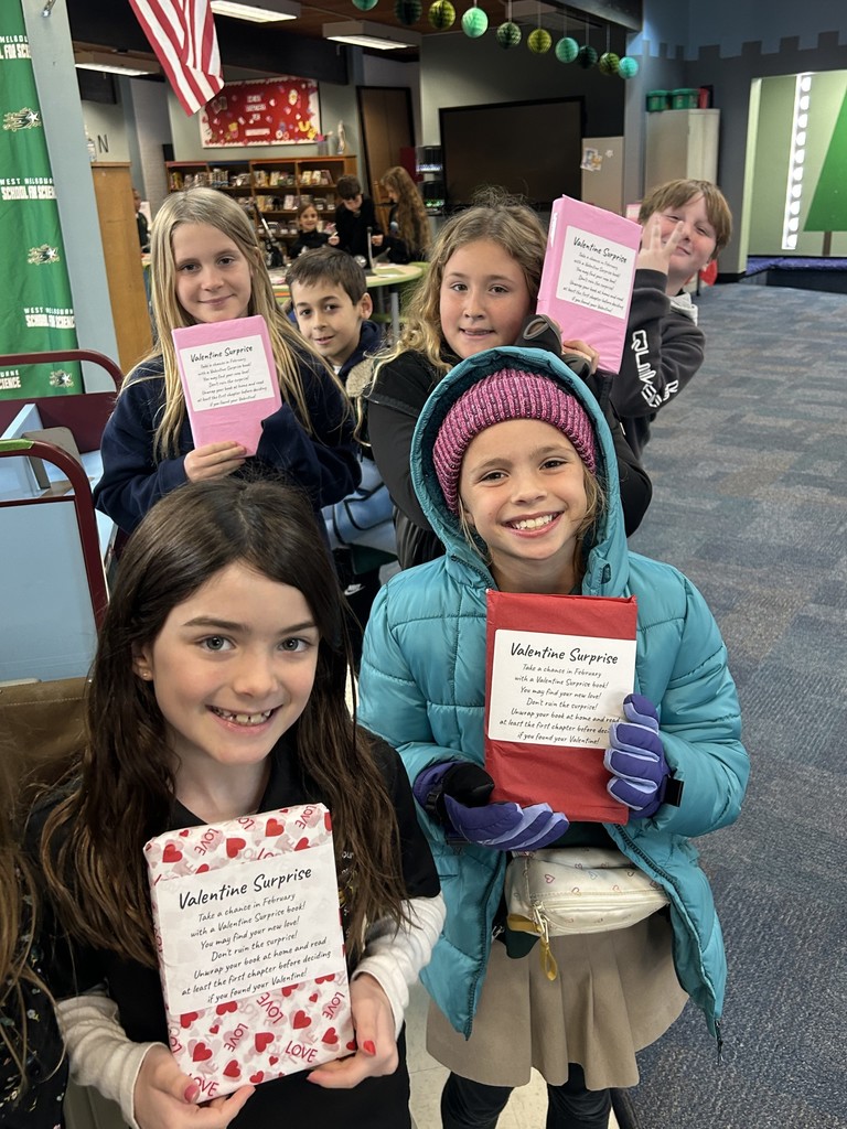 students checking out books