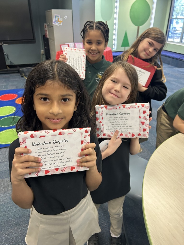 students checking out books