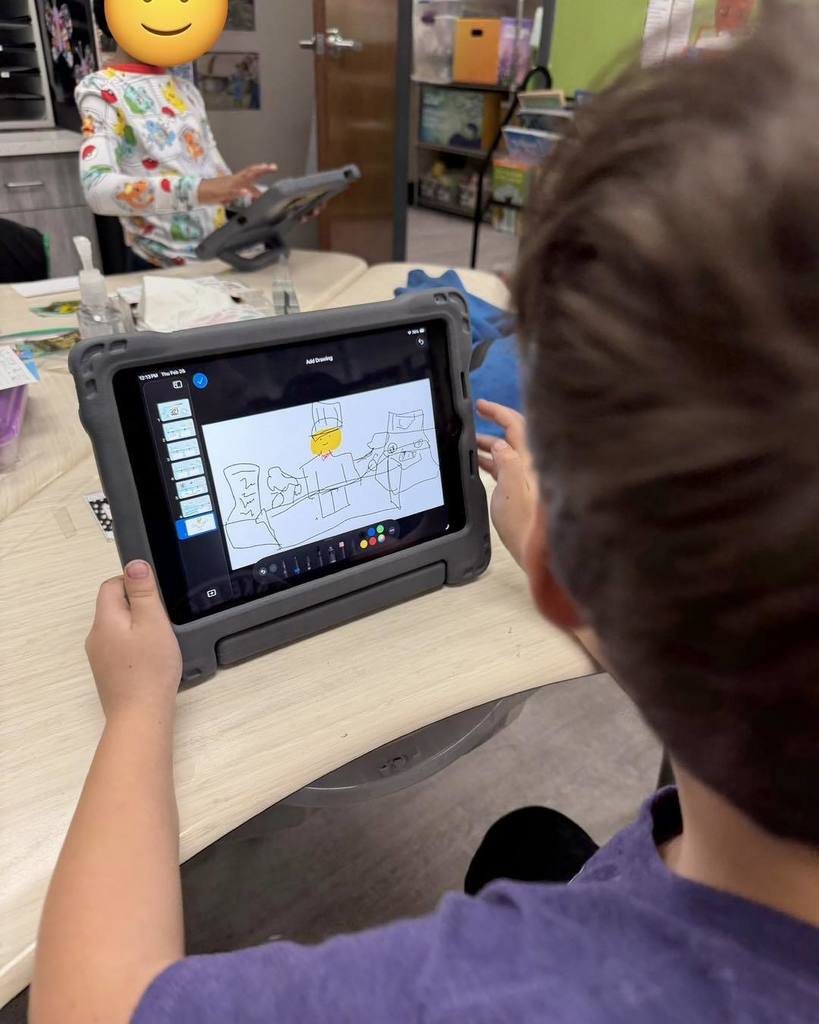 Students using iPads to create their project