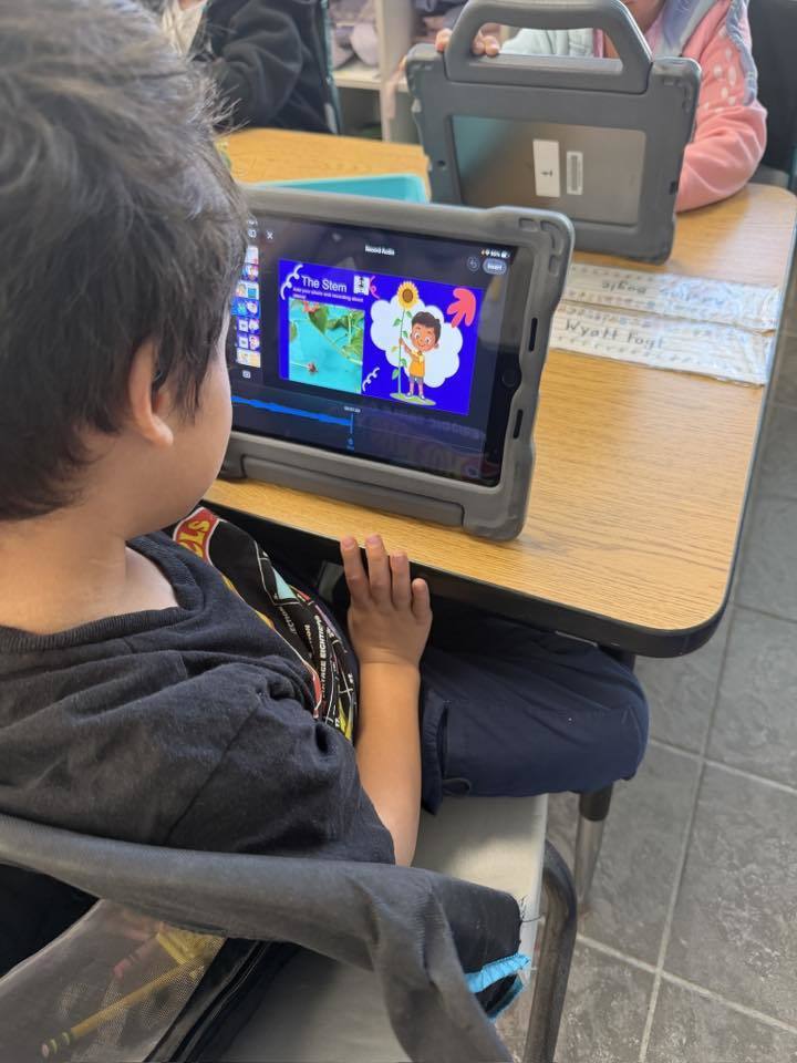 A student working on their plant project on an iPad