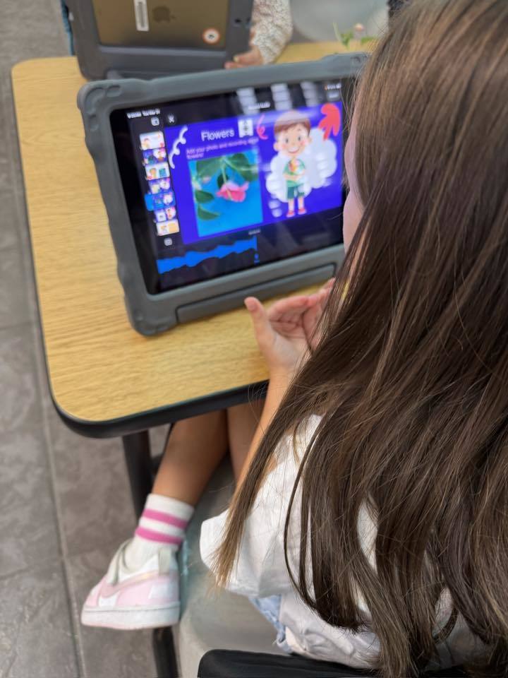 A student working on their plant project on their iPad