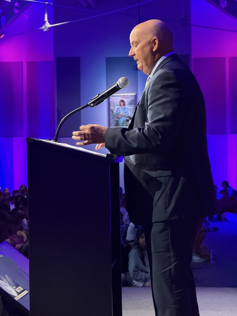 Brevard school superintendent Dr. Rendell at the podium speaking to students