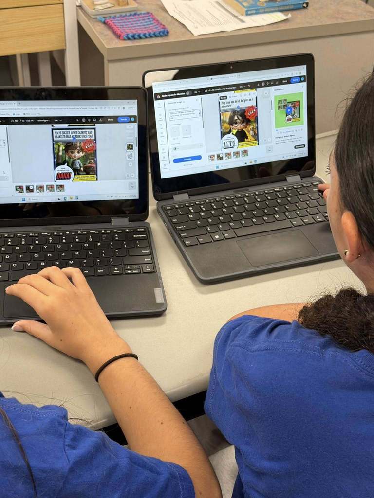 students sitting at their desks working on their computers creating with Canva