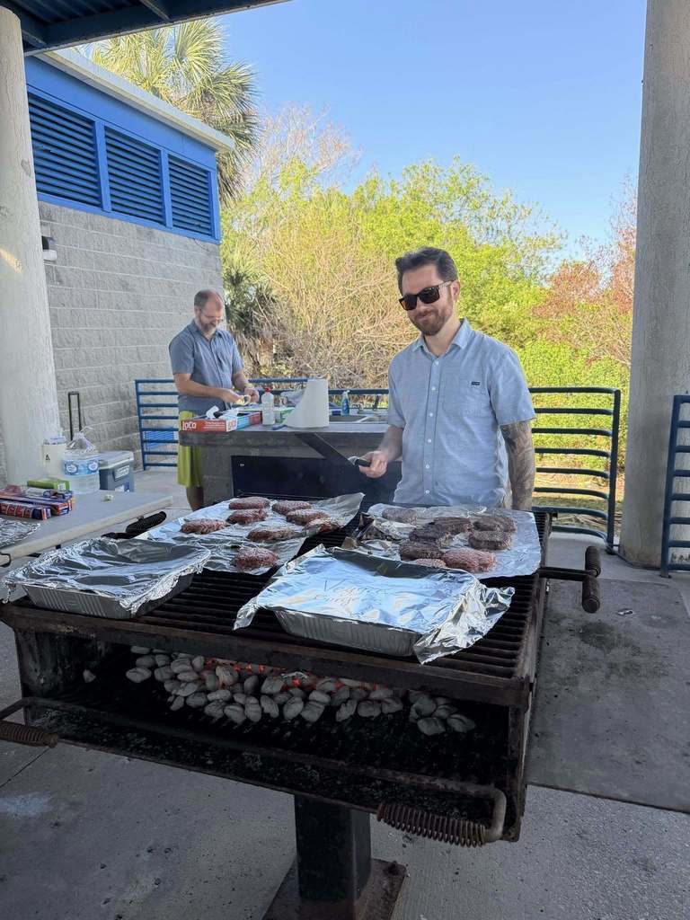 Thomas and Rob preparing lunch grilling 