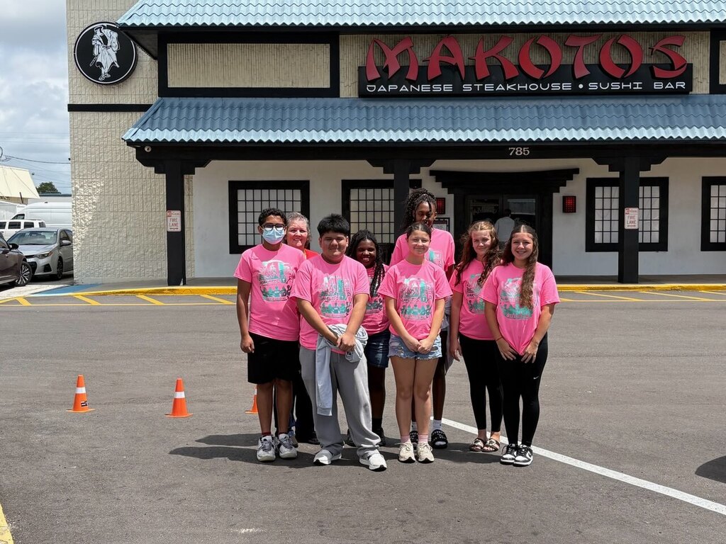 students standing in front of makotos