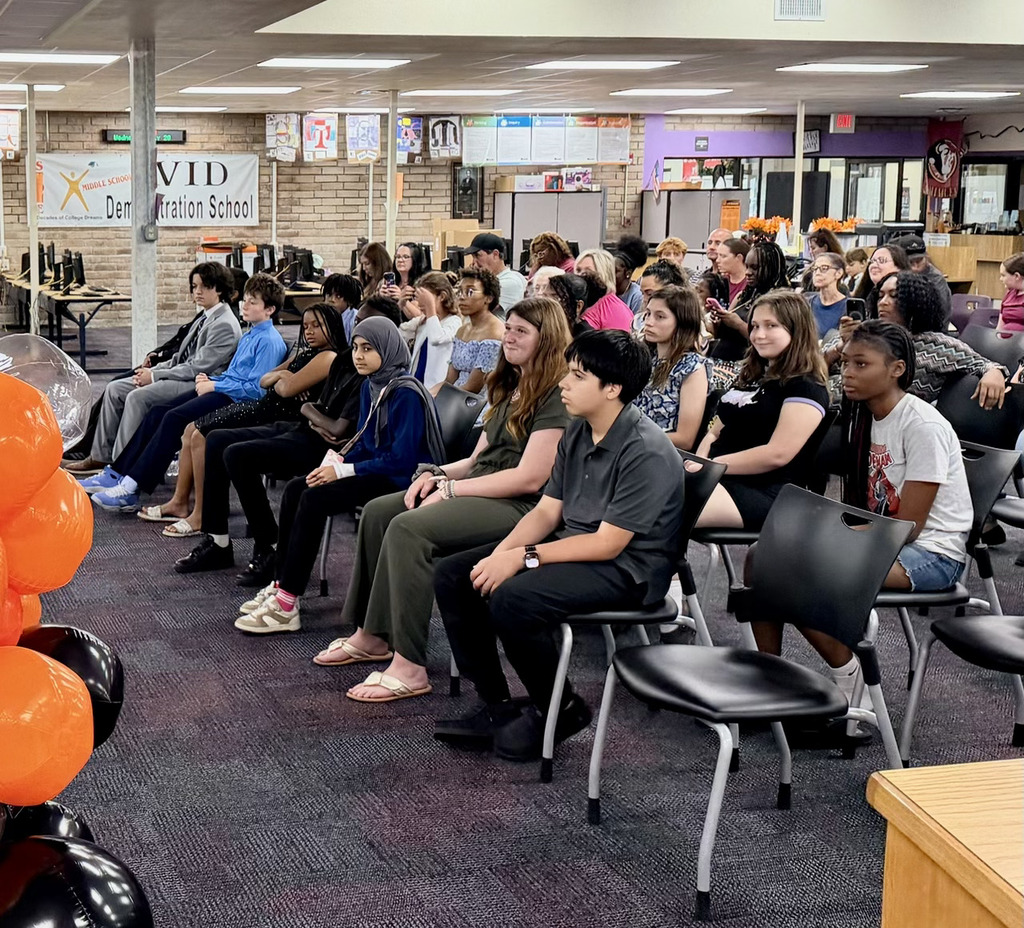students sitting during induction ceremony