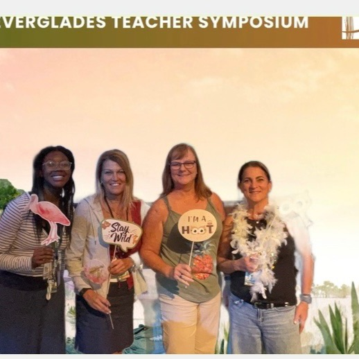 Tkaia, Gina,Anne& Michelle posing with props