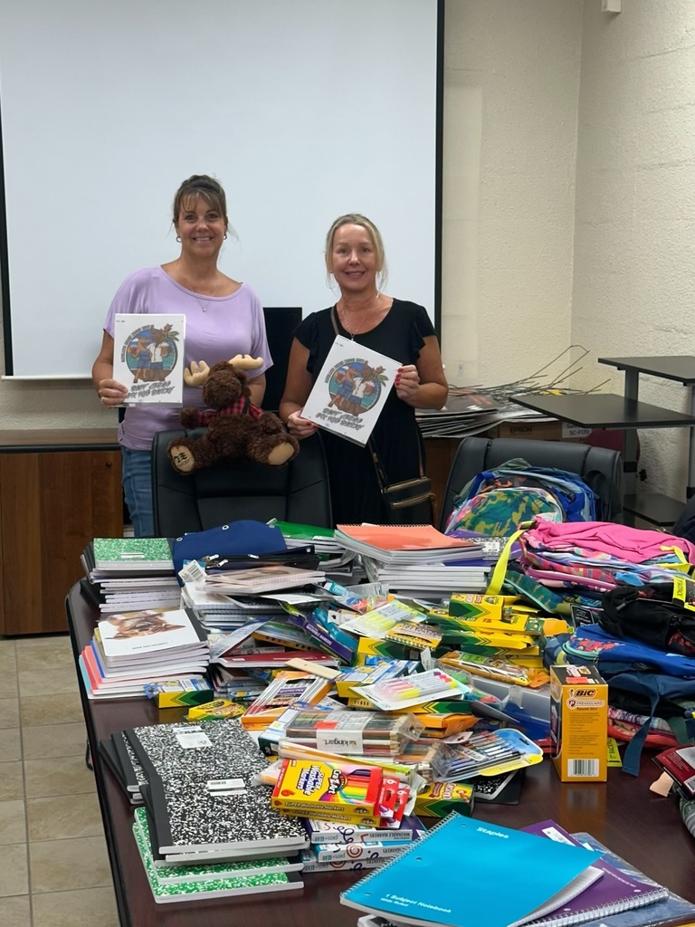 image of jennifer gates and bethany wright surrounded by classroom  supply. 