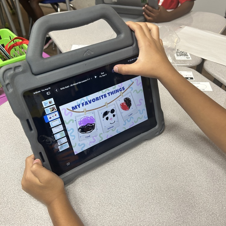 A student uses an iPad to draw and share their favorite things during the “All About Me” lesson.