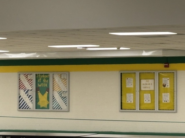Stripes on wall painted green and yellow
