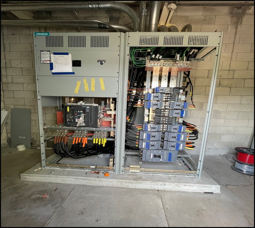 image of a big gray mechanical box full of switches and wires
