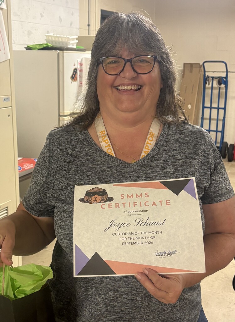 Picture of Joyce Schaust holding certificate
