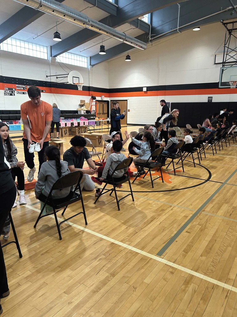 Kids trying on shoes