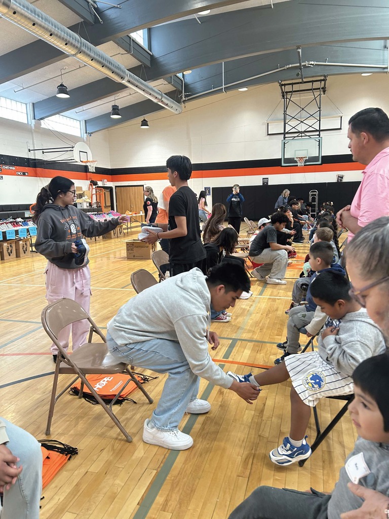 Kids trying on shoes