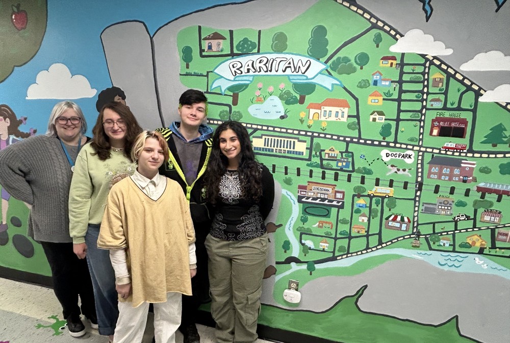 JFK mural and artists