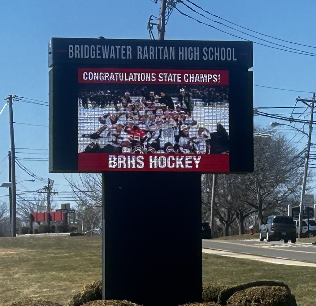 BRHS message board with ice hockey photo