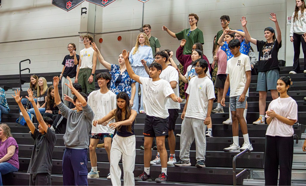 students catch shirts