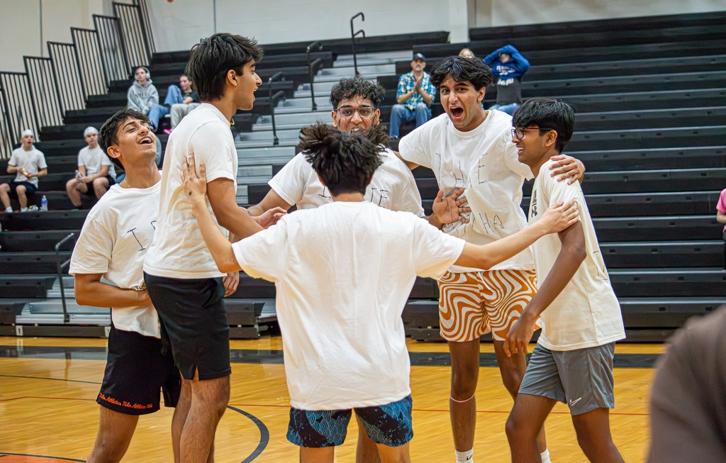 champs team celebrates at volleyball