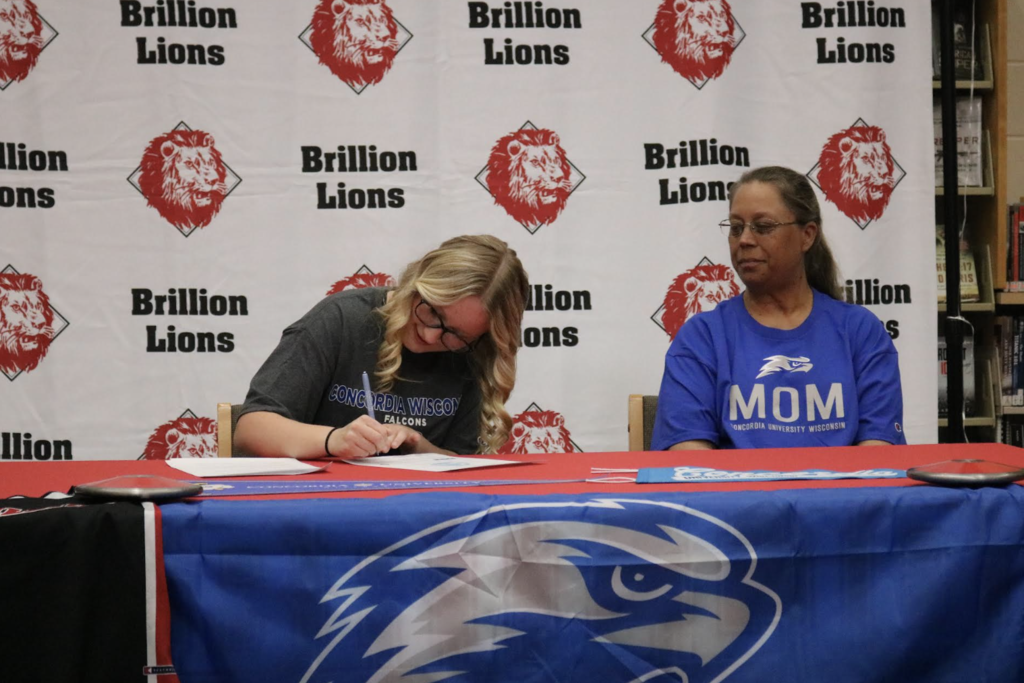 Student signing letter of intent 