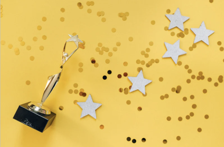 Award on a background of scattered confetti