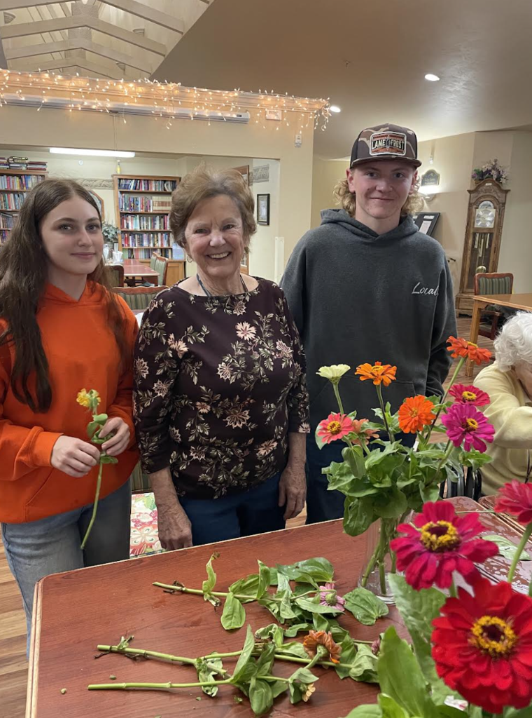 Students assisted residents with flower arrangements