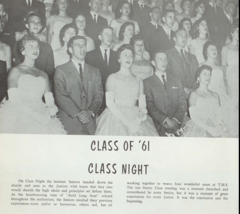 Black-and-white 1961 Tennessee High School yearbook page titled “Class of ’61 Class Night.” The photo shows rows of formally dressed students standing together during the ceremony, with young women wearing gowns and gloves and young men wearing suits and ties. Below the image, a yearbook caption describes the tradition of seniors handing down the shields and axes to the junior class during Class Night.