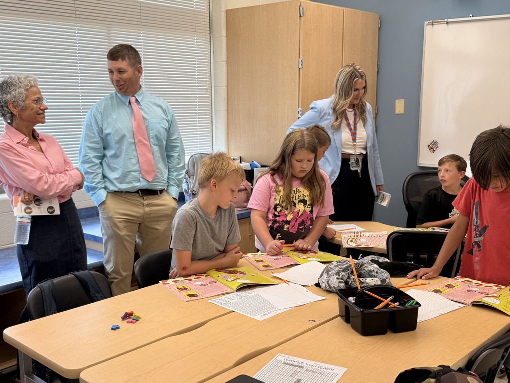 Tennessee Department of Education Commissioner Lizzette Reynolds and district leaders observe elementary students participating in a summer STREAM classroom at Fairmount Elementary School. Students work independently and together on reading and learning activities while visitors engage with the class during the school's summer learning program.